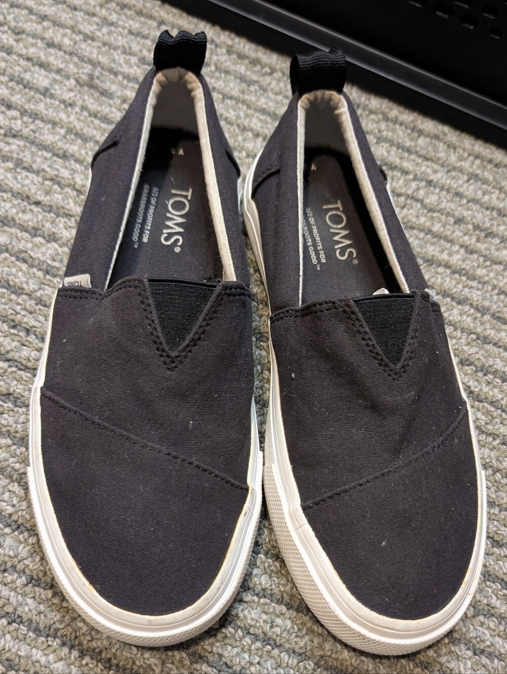 TOMS kids Black Canvas Slip-On Loafers with White Sole